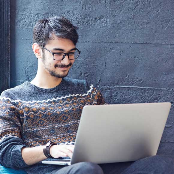 Student learning online with a laptop