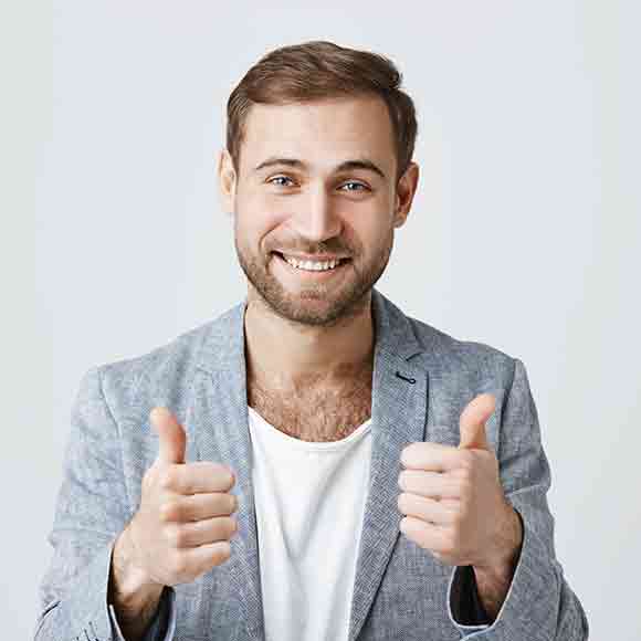 Cheerful professional giving two thumbs up